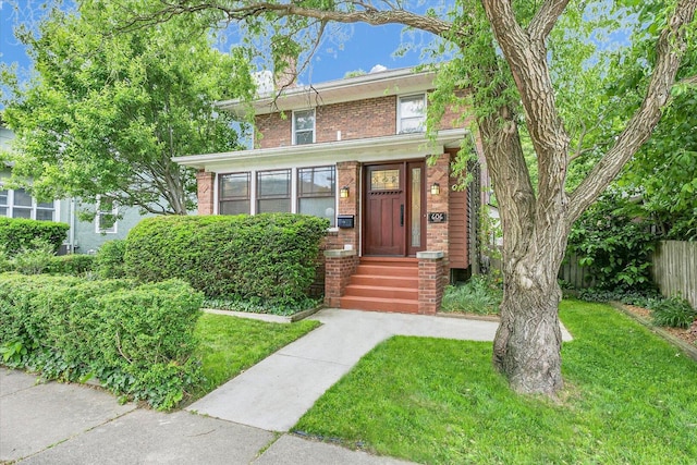 606 S Cedar St, Urbana, IL 61801 - american foursquare style home featuring brick siding