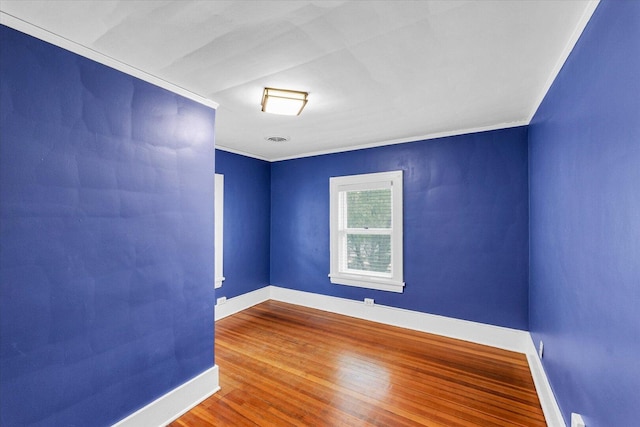 606 S Cedar St, Urbana, IL 61801 - empty room featuring baseboards, ornamental molding, and wood finished floors
