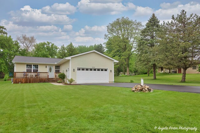 2505 S Harriet Ln, Holiday Hills, IL 60051 - view of front of house featuring asphalt driveway, a garage, a front lawn, and a deck