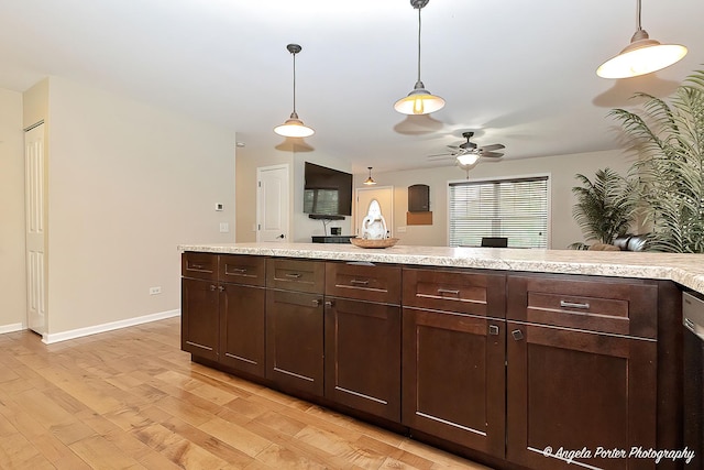 2505 S Harriet Ln, Holiday Hills, IL 60051 - kitchen featuring dark brown cabinetry, light countertops, ceiling fan, light wood-style floors, and baseboards