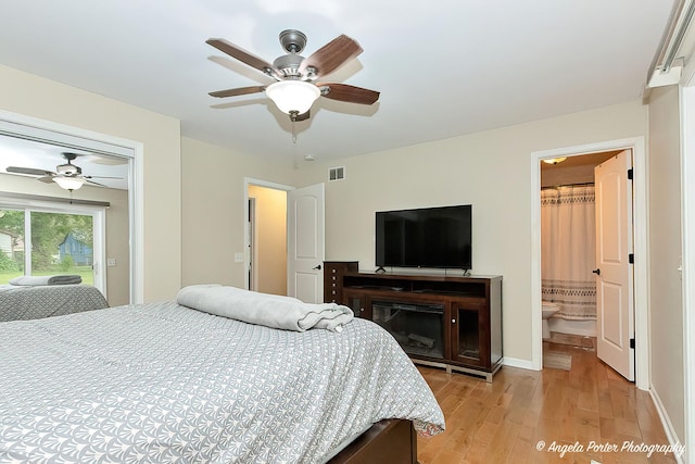 2505 S Harriet Ln, Holiday Hills, IL 60051 - bedroom with light wood-type flooring, access to exterior, a ceiling fan, baseboards, and ensuite bath