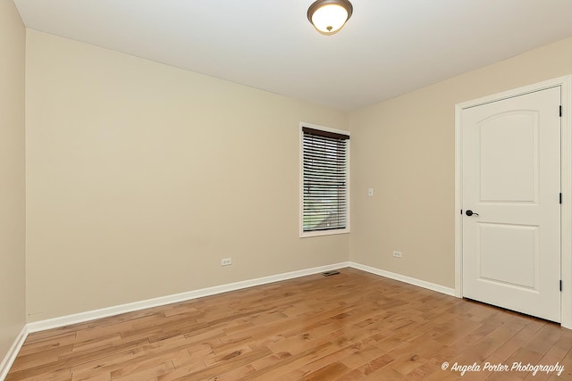 2505 S Harriet Ln, Holiday Hills, IL 60051 - empty room featuring light wood finished floors and baseboards