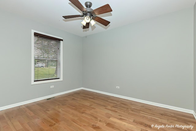 2505 S Harriet Ln, Holiday Hills, IL 60051 - spare room with baseboards, light wood finished floors, and ceiling fan