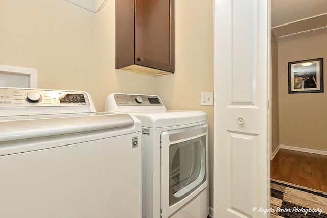 2505 S Harriet Ln, Holiday Hills, IL 60051 - laundry room featuring cabinet space, washer and clothes dryer, and wood finished floors