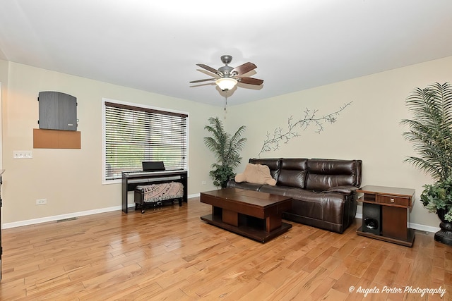 2505 S Harriet Ln, Holiday Hills, IL 60051 - living room featuring light wood-style flooring, a ceiling fan, and baseboards