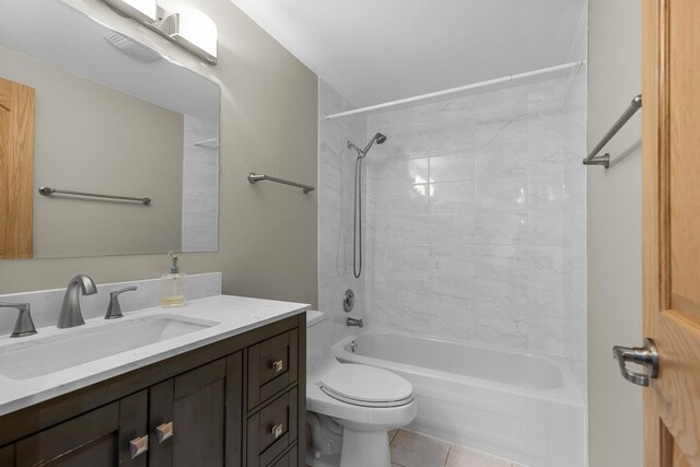 full bathroom featuring toilet, shower / washtub combination, vanity, and tile patterned floors