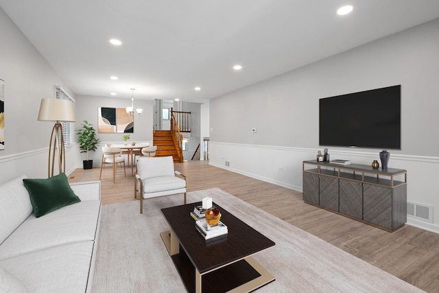 12123 S 72nd Ct, Palos Heights, IL 60463 - living room featuring stairs, wood finished floors, recessed lighting, baseboards, and a chandelier