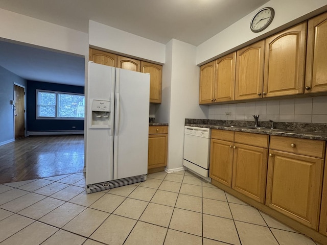 4456 W Gunnison St Unit 2A, Chicago, IL 60630 - kitchen with white appliances, a baseboard heating unit, light tile patterned floors, a sink, and baseboards