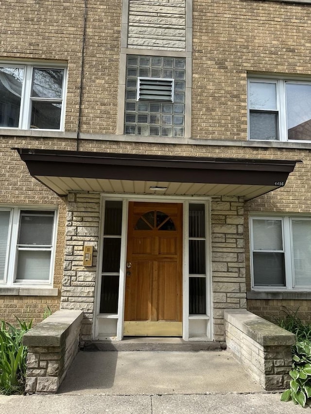 4456 W Gunnison St Unit 2A, Chicago, IL 60630 - view of exterior entry with stone siding and brick siding