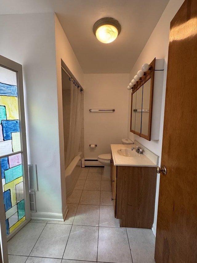 4456 W Gunnison St Unit 2A, Chicago, IL 60630 - bathroom featuring baseboard heating, tile patterned floors, toilet, and vanity