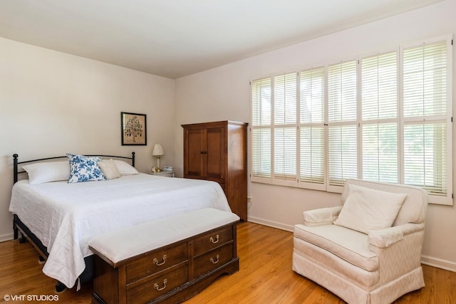 14642 S Pebble Creek Dr, Homer Glen, IL 60491 - bedroom with baseboards and light wood-type flooring