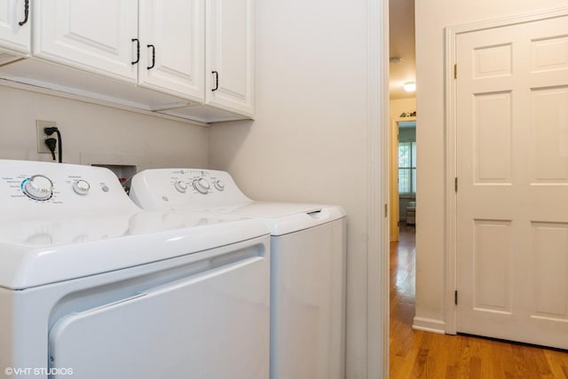14642 S Pebble Creek Dr, Homer Glen, IL 60491 - laundry area with washer and dryer, light wood-type flooring, and cabinet space