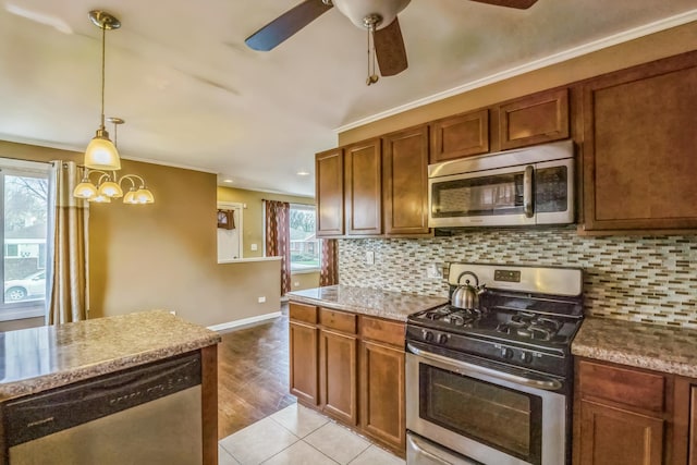 12817 S Racine Ave, Calumet Park, IL 60827 - kitchen with stainless steel appliances, ceiling fan, tasteful backsplash, pendant lighting, and baseboards
