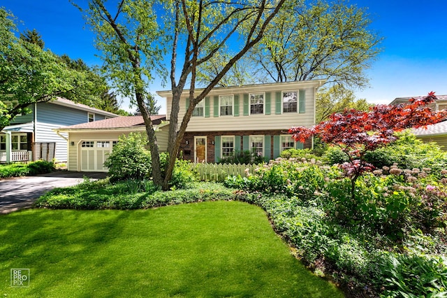 1532 Chat Ct, Naperville, IL 60565 - colonial home with a garage, driveway, a front lawn, and brick siding