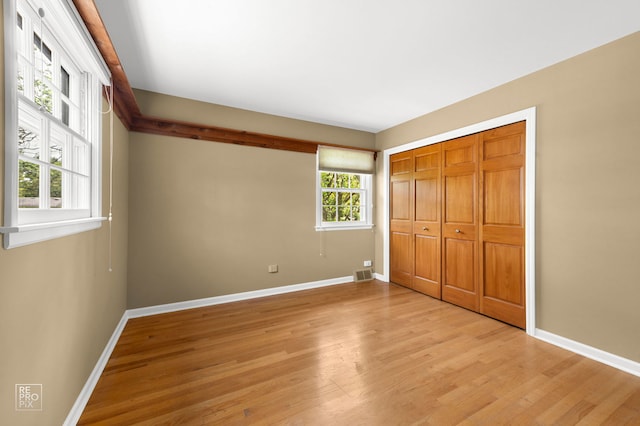 1532 Chat Ct, Naperville, IL 60565 - unfurnished bedroom with light wood-type flooring, baseboards, and a closet