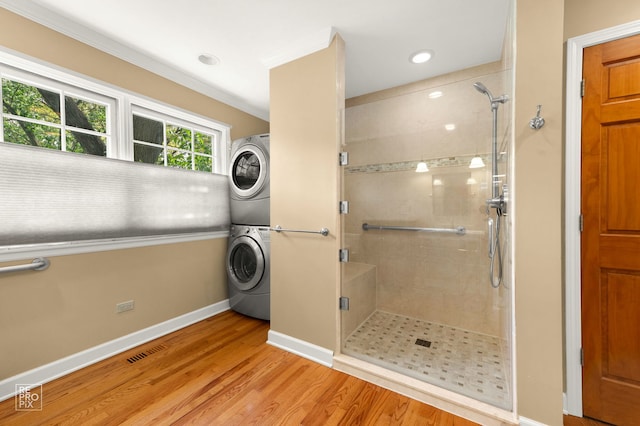 1532 Chat Ct, Naperville, IL 60565 - bathroom with stacked washer / dryer, a shower stall, baseboards, wood finished floors, and recessed lighting