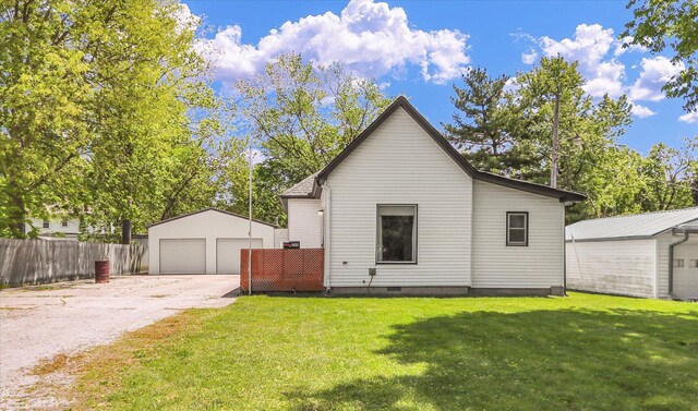 200 Ennis Ln, Urbana, IL 61802 - view of front of house with an outdoor structure, a garage, and crawl space