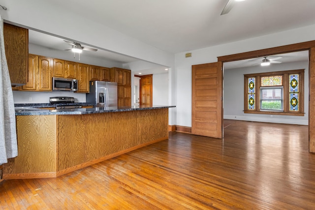 201 E Court St, Paris, IL 61944 - kitchen featuring appliances with stainless steel finishes, ceiling fan, light wood-style flooring, and baseboards