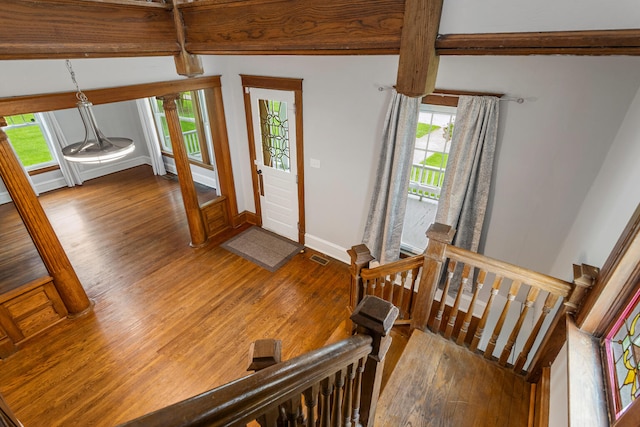 201 E Court St, Paris, IL 61944 - entryway featuring wood finished floors, plenty of natural light, baseboards, and beam ceiling