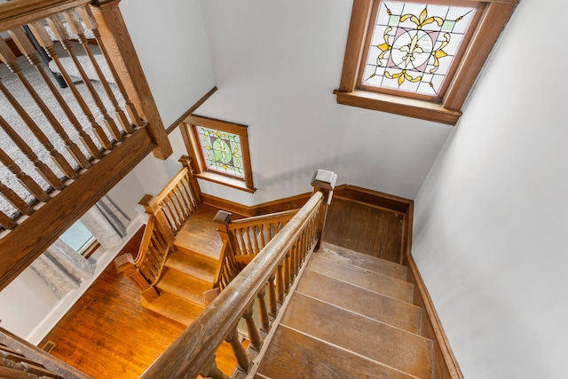 201 E Court St, Paris, IL 61944 - stairway featuring a towering ceiling and wood finished floors