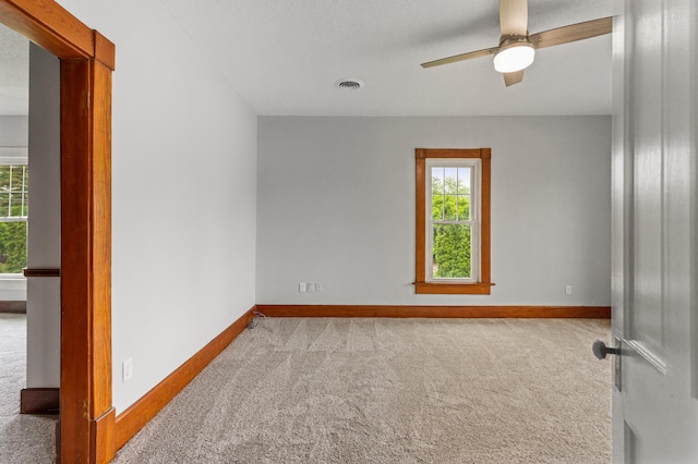 201 E Court St, Paris, IL 61944 - empty room with carpet flooring, baseboards, and a ceiling fan