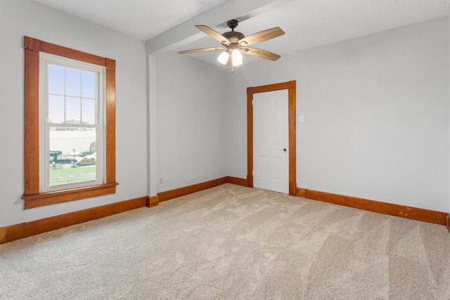 201 E Court St, Paris, IL 61944 - unfurnished room with baseboards, light colored carpet, and ceiling fan