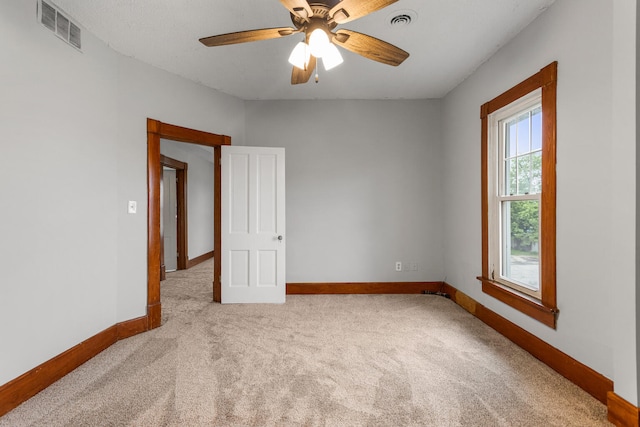201 E Court St, Paris, IL 61944 - unfurnished room featuring carpet flooring, baseboards, and ceiling fan