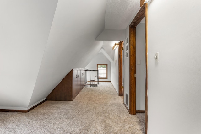 201 E Court St, Paris, IL 61944 - corridor featuring an upstairs landing, carpet floors, and lofted ceiling