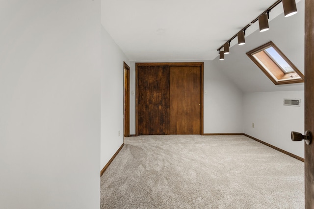 201 E Court St, Paris, IL 61944 - bonus room featuring a skylight, carpet floors, baseboards, and vaulted ceiling