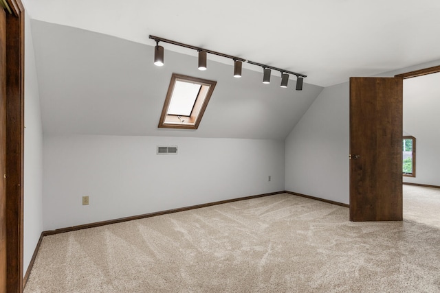 201 E Court St, Paris, IL 61944 - bonus room featuring carpet, a skylight, vaulted ceiling, and baseboards