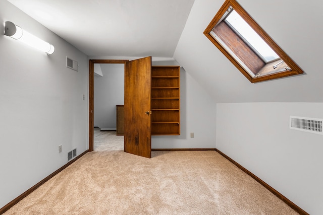 201 E Court St, Paris, IL 61944 - additional living space featuring a skylight, carpet, lofted ceiling, and baseboards