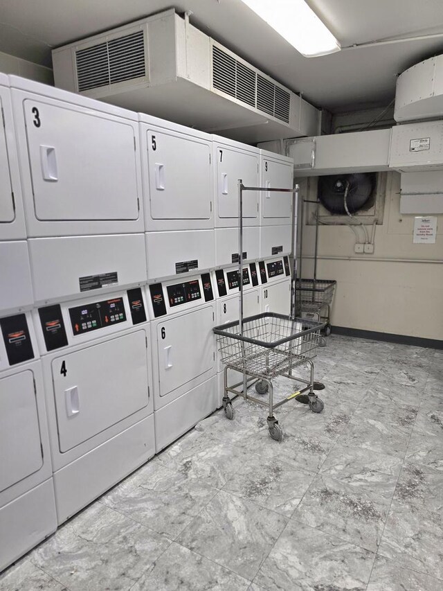 4800 S Chicago Beach Dr Unit 1211N, Chicago, IL 60615 - shared laundry room featuring stacked washing machine and dryer and baseboards