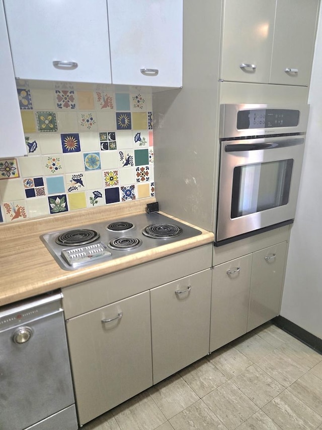 4800 S Chicago Beach Dr Unit 1211N, Chicago, IL 60615 - kitchen featuring appliances with stainless steel finishes, light countertops, backsplash, and white cabinetry