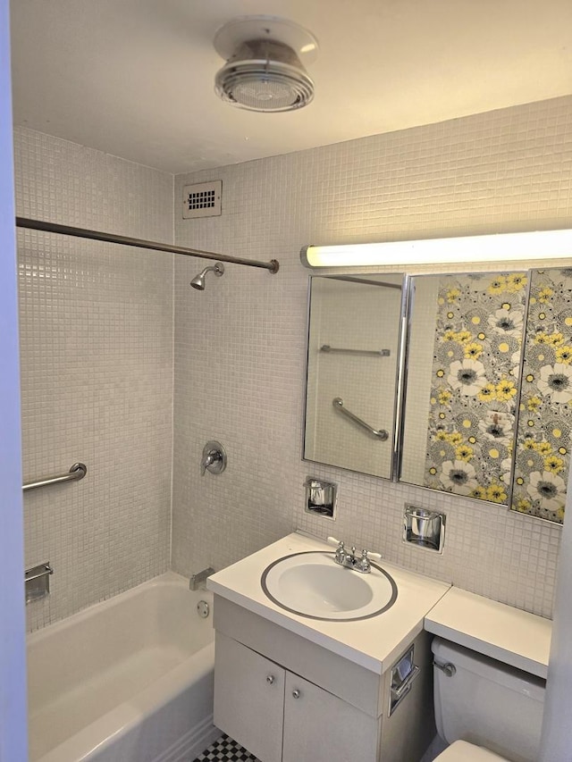 4800 S Chicago Beach Dr Unit 1211N, Chicago, IL 60615 - bathroom featuring toilet, tile walls, vanity, bathtub / shower combination, and tasteful backsplash