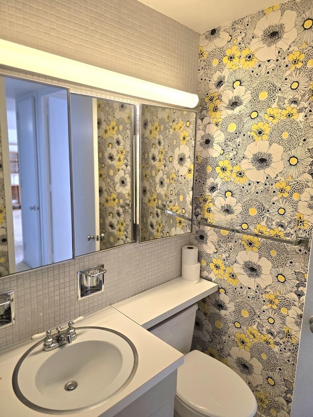 4800 S Chicago Beach Dr Unit 1211N, Chicago, IL 60615 - bathroom with tile walls, toilet, backsplash, and vanity