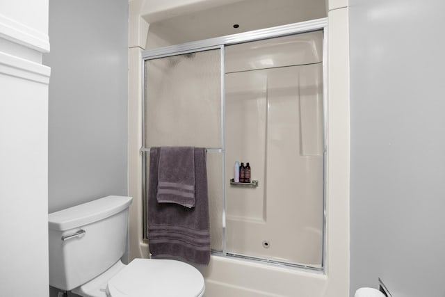 540 Biesterfield Rd Unit 104A, Elk Grove Village, IL 60007 - full bathroom featuring toilet and bath / shower combo with glass door