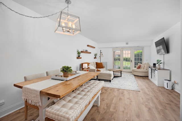 540 Biesterfield Rd Unit 104A, Elk Grove Village, IL 60007 - dining space featuring light wood finished floors, a chandelier, and baseboards