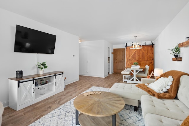 540 Biesterfield Rd Unit 104A, Elk Grove Village, IL 60007 - living area with light wood finished floors, a barn door, and baseboards
