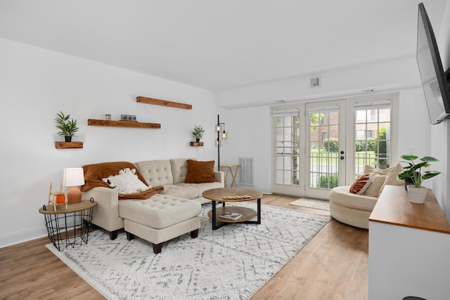 540 Biesterfield Rd Unit 104A, Elk Grove Village, IL 60007 - living room featuring wood finished floors, baseboards, and french doors