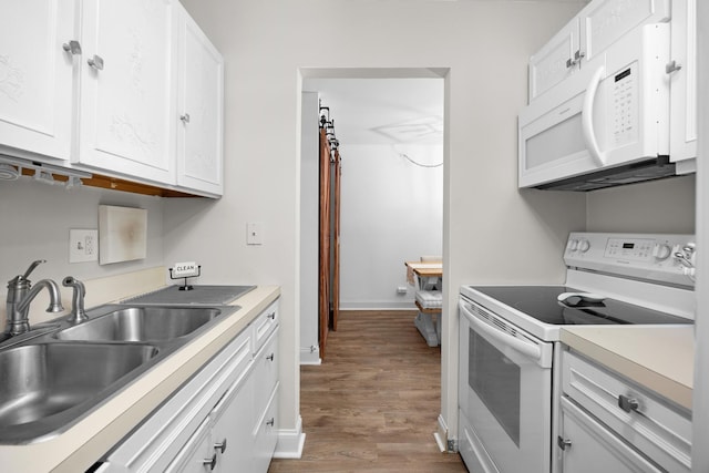 540 Biesterfield Rd Unit 104A, Elk Grove Village, IL 60007 - kitchen featuring white appliances, a sink, wood finished floors, and white cabinets