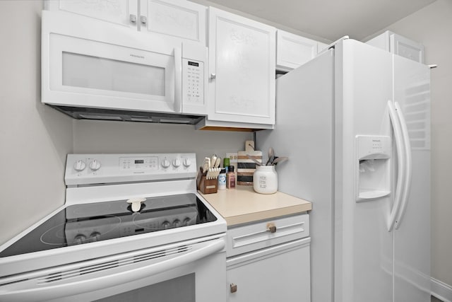 540 Biesterfield Rd Unit 104A, Elk Grove Village, IL 60007 - kitchen with white appliances, white cabinetry, and light countertops