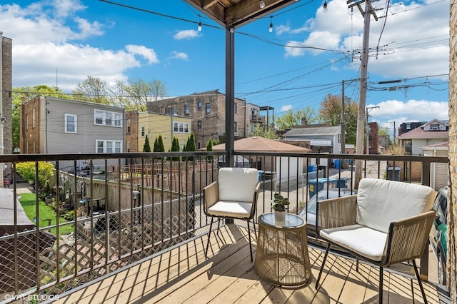 2217 W Foster Ave Unit 1, Chicago, IL 60625 - wooden deck featuring a residential view