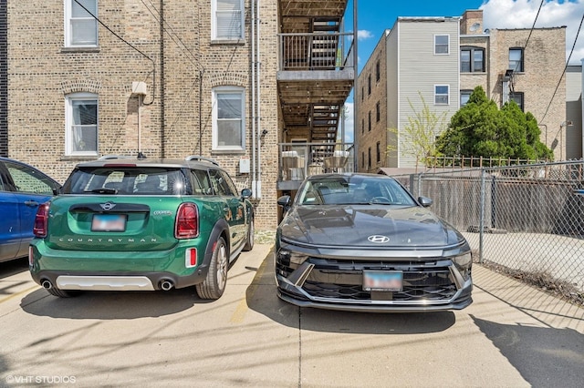2217 W Foster Ave Unit 1, Chicago, IL 60625 - view of parking featuring fence