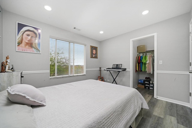 1913 Misty Ridge Ln, Aurora, IL 60503 - bedroom featuring dark wood-type flooring, a walk in closet, recessed lighting, baseboards, and a closet