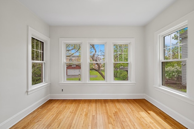 1557 Green Bay Rd, Highland Park, IL 60035 - spare room featuring healthy amount of natural light, light wood-style floors, and baseboards