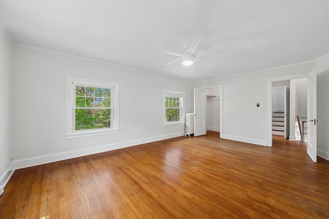 1557 Green Bay Rd, Highland Park, IL 60035 - unfurnished bedroom featuring crown molding, hardwood / wood-style flooring, radiator heating unit, baseboards, and a ceiling fan