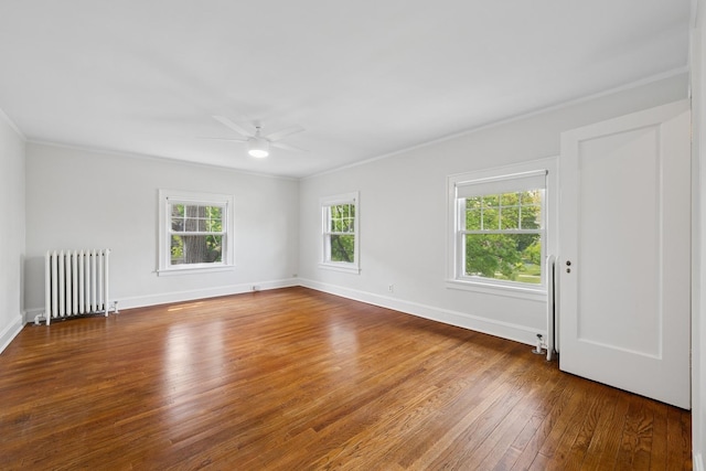 1557 Green Bay Rd, Highland Park, IL 60035 - empty room featuring radiator heating unit, ornamental molding, ceiling fan, hardwood / wood-style flooring, and baseboards