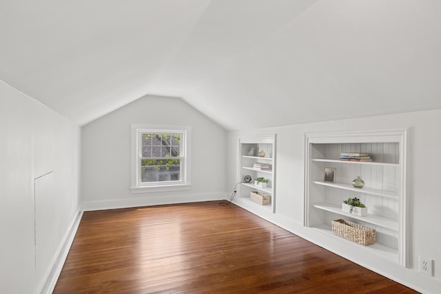 1557 Green Bay Rd, Highland Park, IL 60035 - bonus room featuring built in shelves, lofted ceiling, wood finished floors, and baseboards