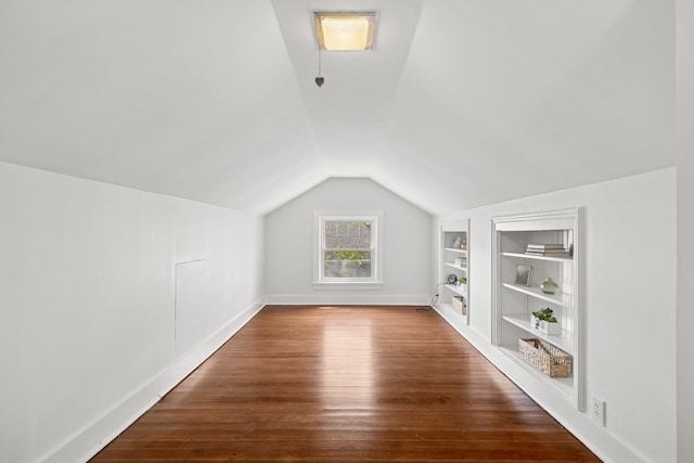 1557 Green Bay Rd, Highland Park, IL 60035 - additional living space featuring built in features, lofted ceiling, wood finished floors, and baseboards