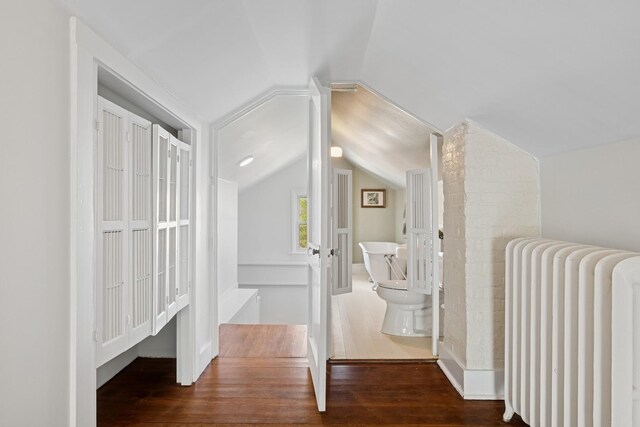 1557 Green Bay Rd, Highland Park, IL 60035 - hallway with radiator heating unit, lofted ceiling, and wood finished floors